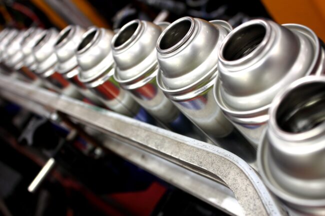 Aerosol can products being made in aerosol filling factory
